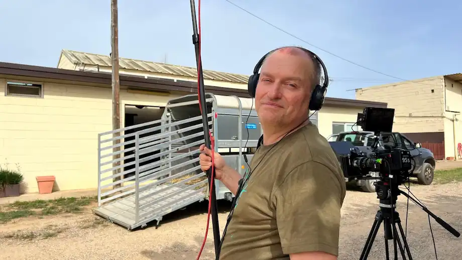boom operator recording sound during the production of the documentary "the horse clinik"