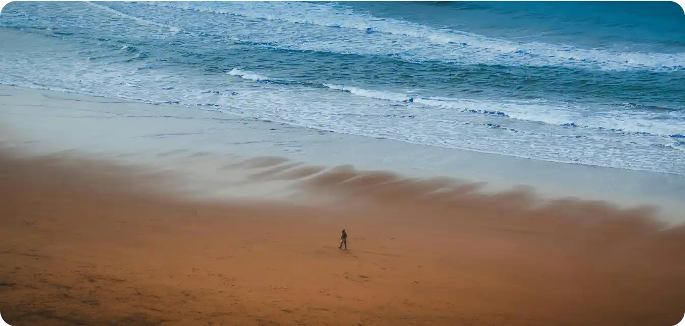 actor walking on a beach in bilbao